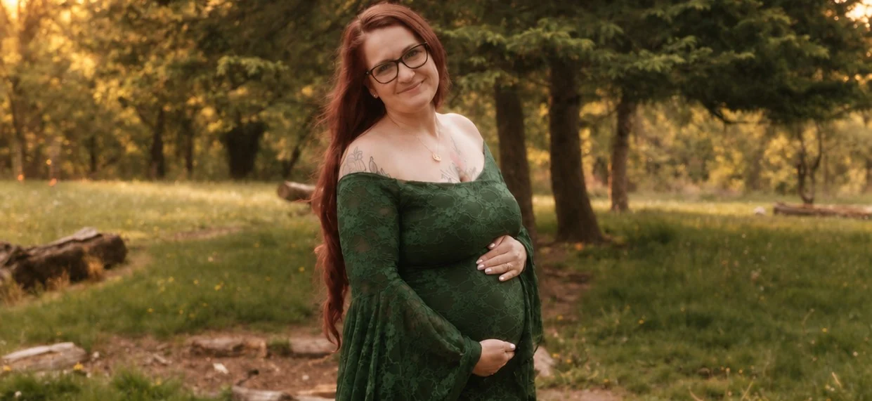 Expectant gestational carrier holding an ultrasound print